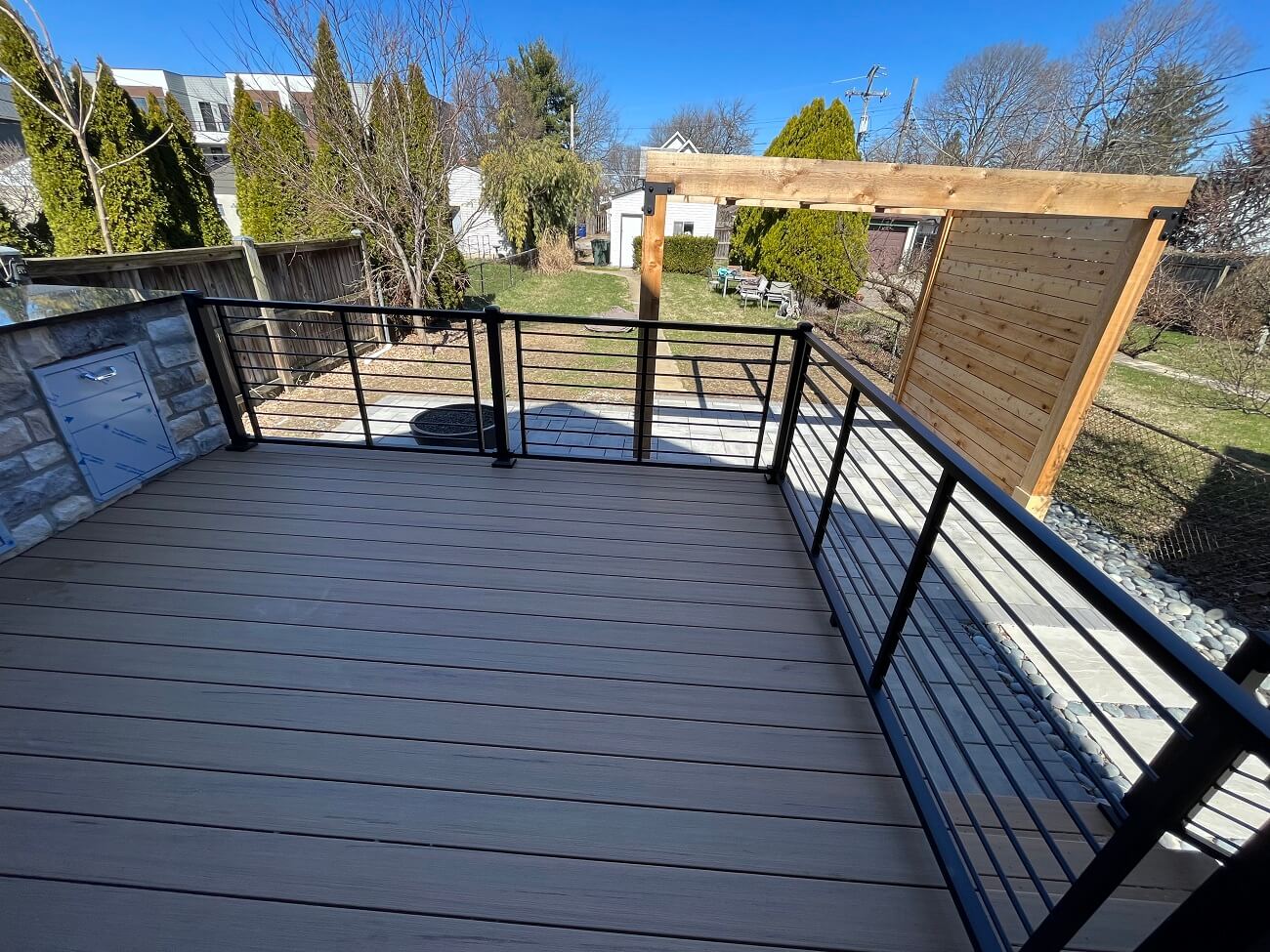 deck with overhead pergola and outdoor kitchen